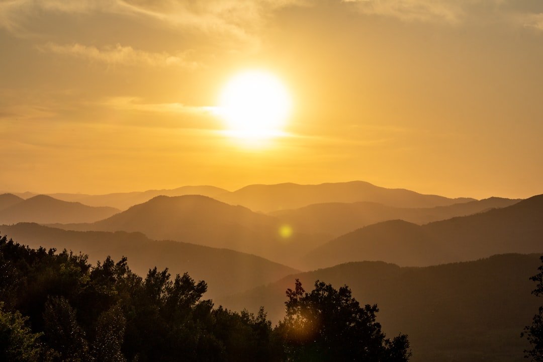 Services the-sun-is-setting-over-a-mountain-range-hxzjazxpiey